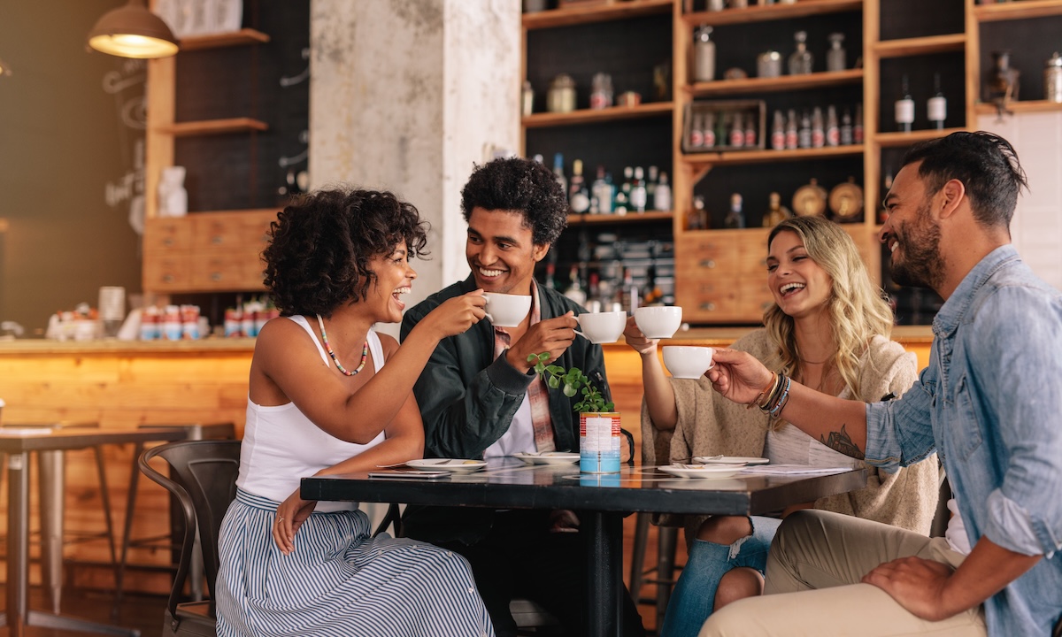 friends in a cafe drinking coffee