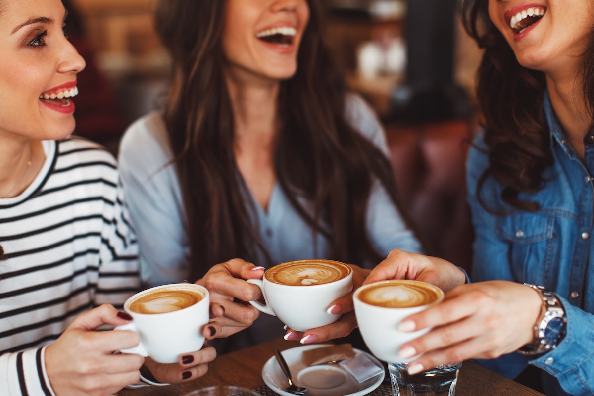 friends in a cafe drinking coffee