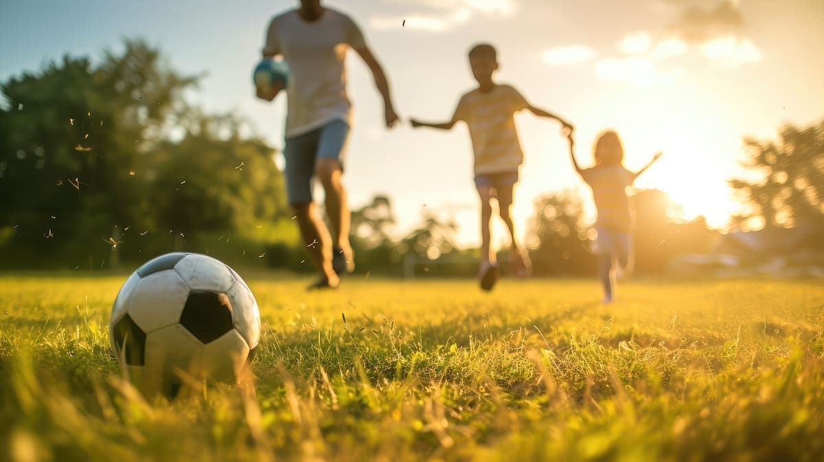 family playing soccer