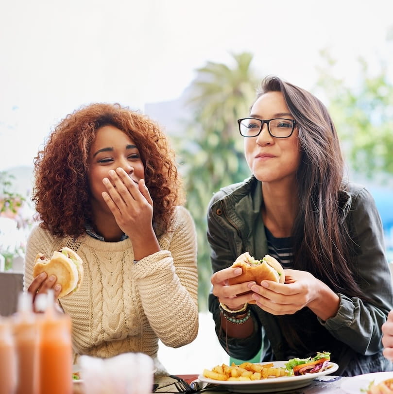 people eating burgers